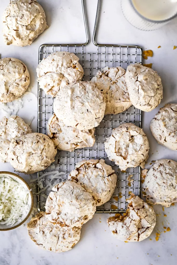 With the addition of corn flake crumbs, these coconut cookies are a cross between meringue cookies and coconut macaroons.