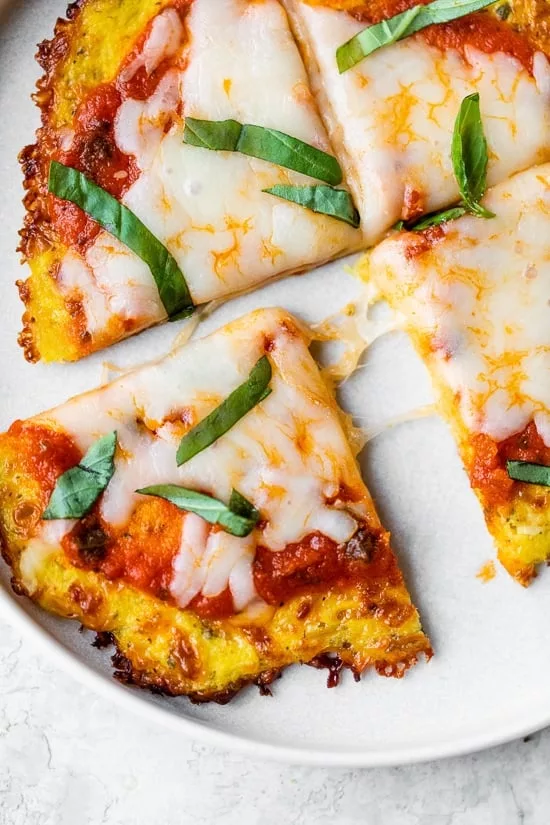 In addition to being a terrific way to get more veggies and fiber, this spaghetti squash crust is a great alternative to classic pizza made with grains. 