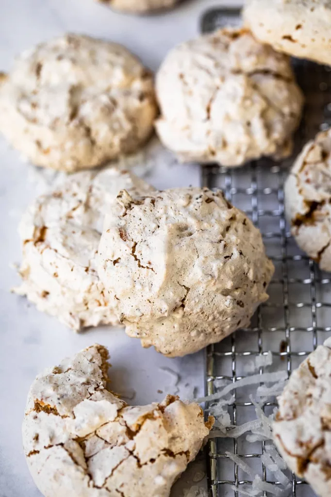With the addition of corn flake crumbs, these coconut cookies are a cross between meringue cookies and coconut macaroons.