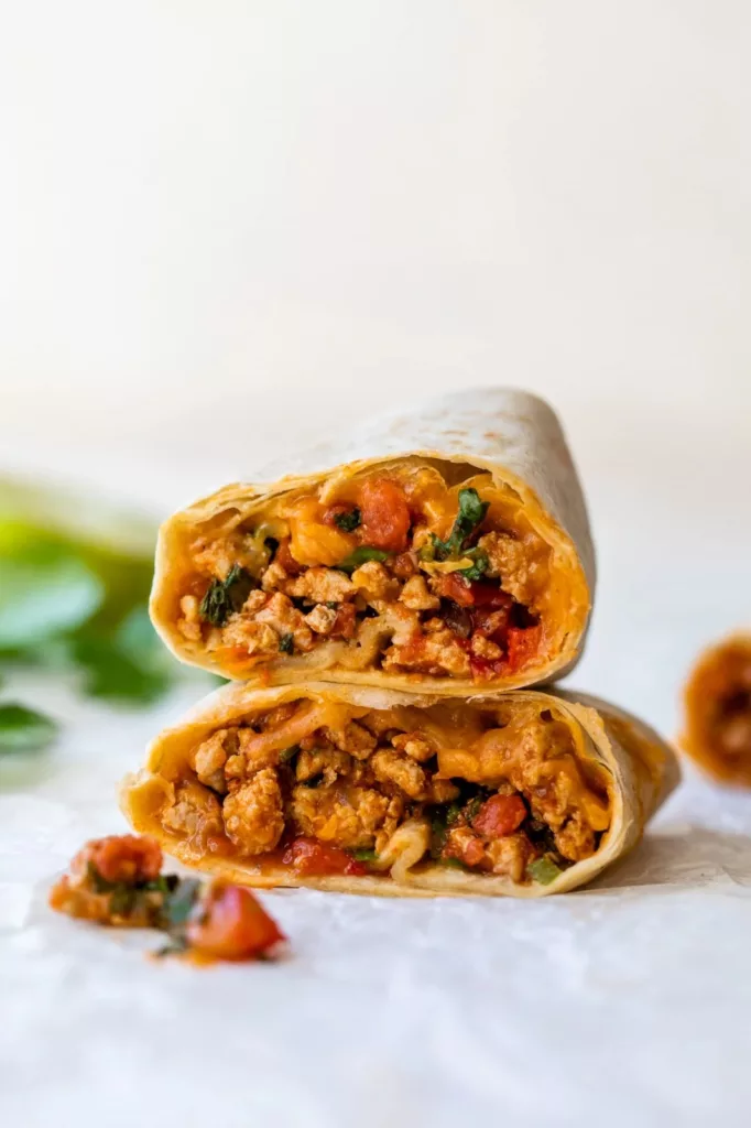 This healthier version of Meximelt is made with ground turkey seasoned with my own taco flavor and served inside a tortilla with pico de gallo and melted cheese.