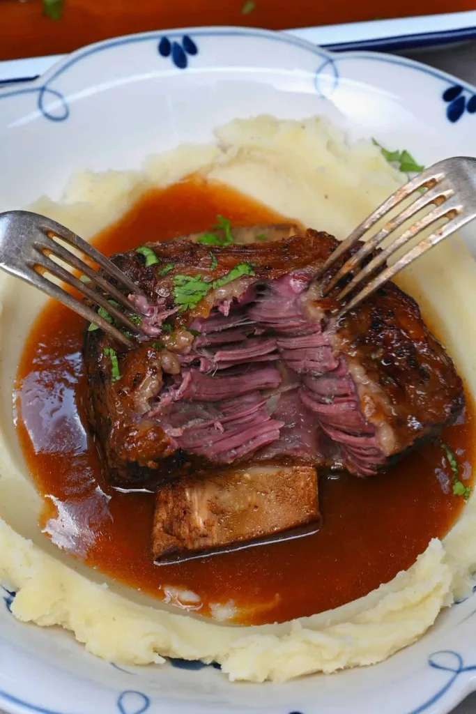 Easy to prepare and the ideal comforting midweek meal, these slow cooker short ribs include succulent, delicate meat that falls from the bone in a thick, hearty sauce.