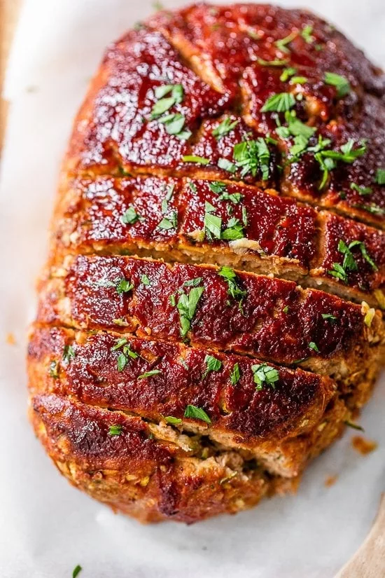 Grated zucchini added to turkey meatloaf makes it the juiciest. It's simple to make this meatloaf: just combine all the ingredients, form it into a loaf, and bake