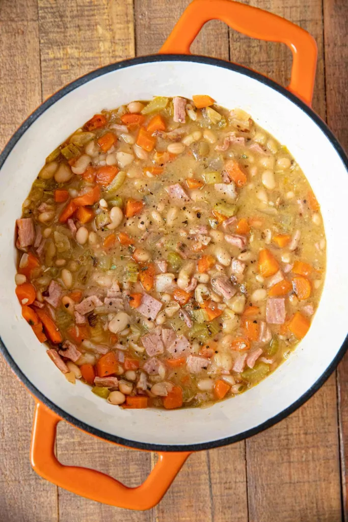 An hour may be spent making this quick and simple recipe for Ham and Bean Soup with leftover ham that you already have on hand!