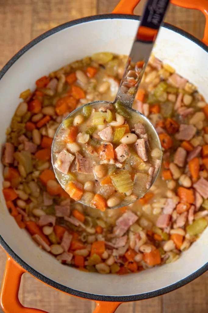 An hour may be spent making this quick and simple recipe for Ham and Bean Soup with leftover ham that you already have on hand!